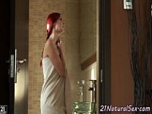Redhead babe masturbates in the bathroom